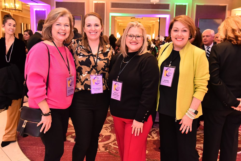 Four ladies posing at convention