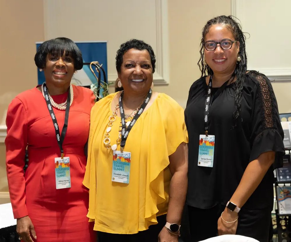 Three ladies posing at convention