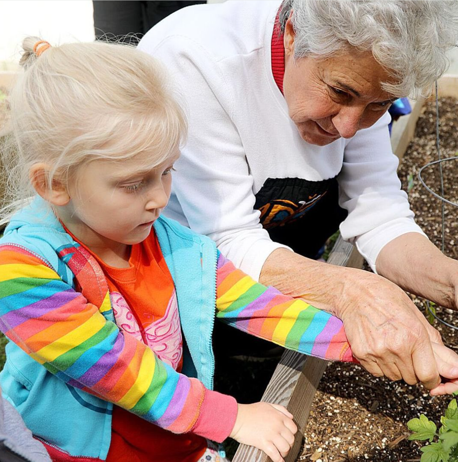 Jinx Vidrine with child in the garden