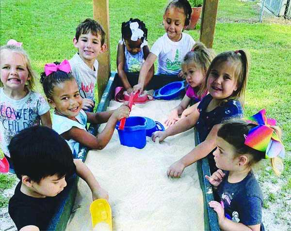 children around sandbox