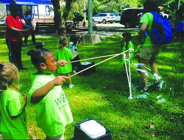 girl playing with slingshot